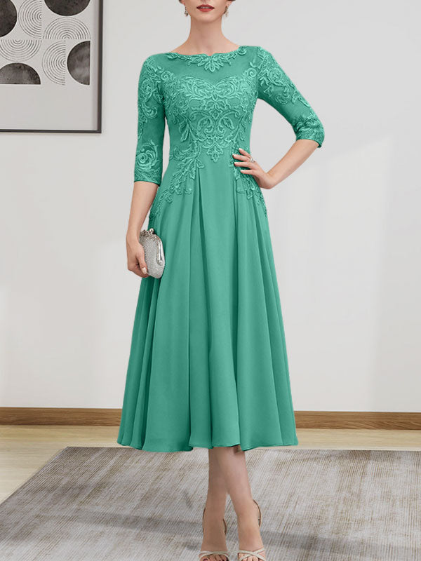 Vestido de novia de corte A, escote redondo ilusión, largo té, de gasa, encaje, con lentejuelas y pedrería.