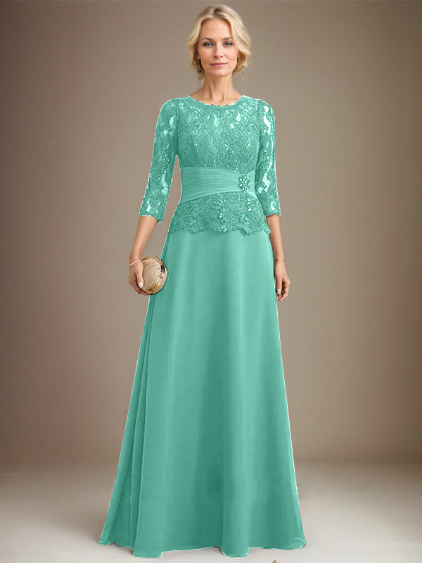 Vestido de corte A, escote ilusión, largo hasta el suelo, de gasa y encaje, para la madre de la novia, con lentejuelas plisadas y pedrería. 