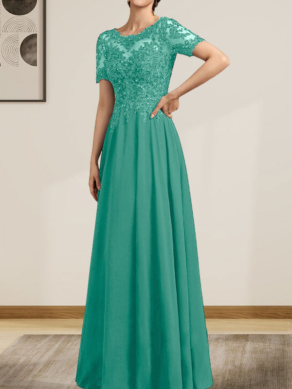 Vestido de corte A, escote ilusión, largo hasta el suelo, de gasa y encaje, con lentejuelas y pedrería, para la madre de la novia.