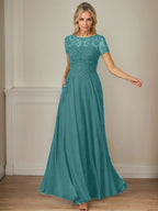 Robe en mousseline de soie bleu marine foncé, coupe trapèze, col bateau et sequins 