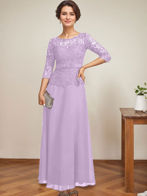 Vestido de novia corte A, escote redondo ilusión, largo hasta el tobillo, de gasa y encaje, con pedrería y detalles de diamantes de imitación. 