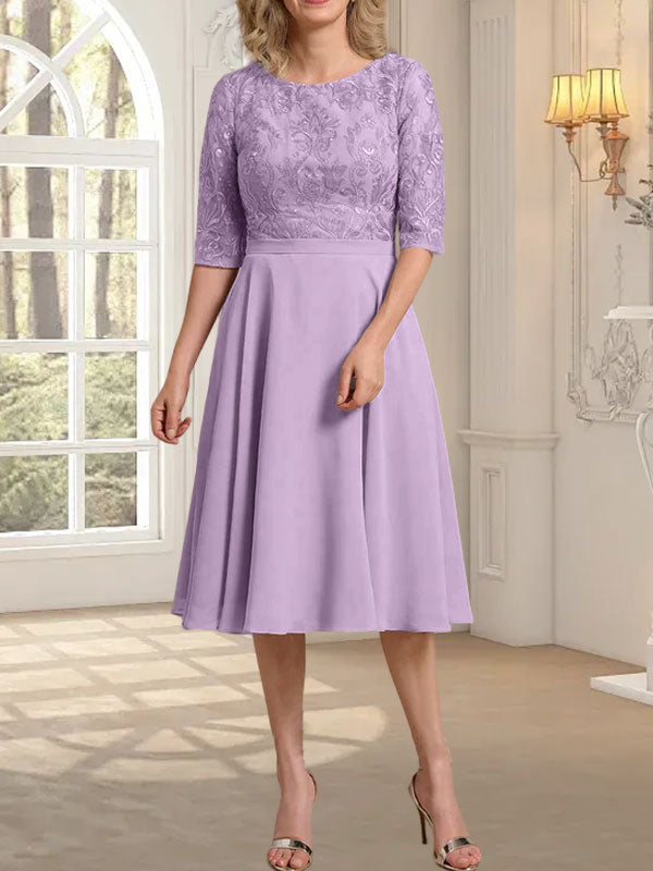 Vestido de novia de gasa de encaje, corte en A, escote redondo y largo hasta la rodilla.