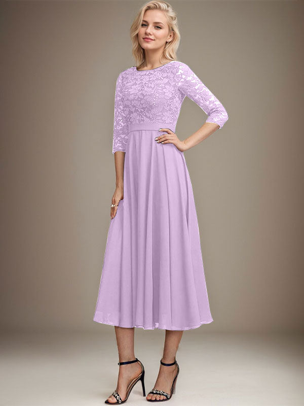Vestido de novia de corte línea A, escote redondo, largo hasta la rodilla, de encaje y gasa con lentejuelas.