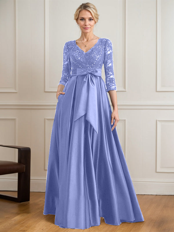 Vestido de novia de satén con encaje, corte en A, escote en V y largo hasta el suelo, con lazo de lentejuelas. 