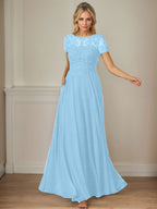 Robe en mousseline de soie bleu marine foncé, coupe trapèze, col bateau et sequins 