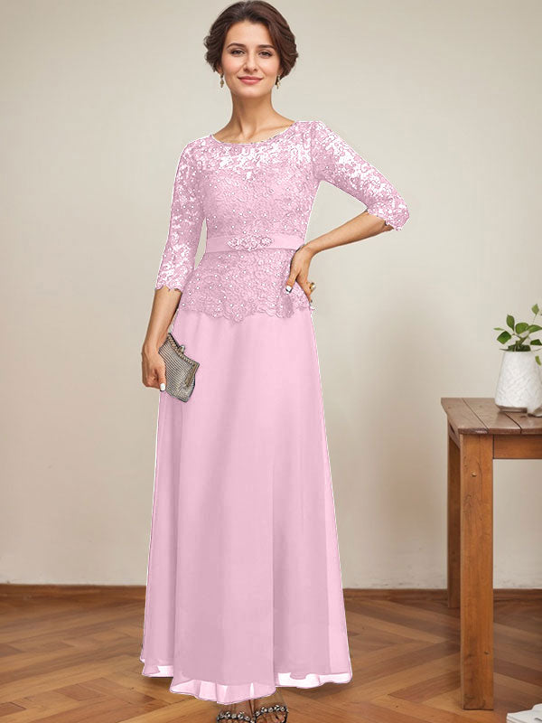 Vestido de novia corte A, escote redondo ilusión, largo hasta el tobillo, de gasa y encaje, con pedrería y detalles de diamantes de imitación. 