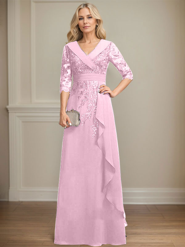 Vestido de novia de corte línea A, cuello en V, largo hasta el suelo, de encaje y gasa, con lentejuelas y volantes en cascada. 