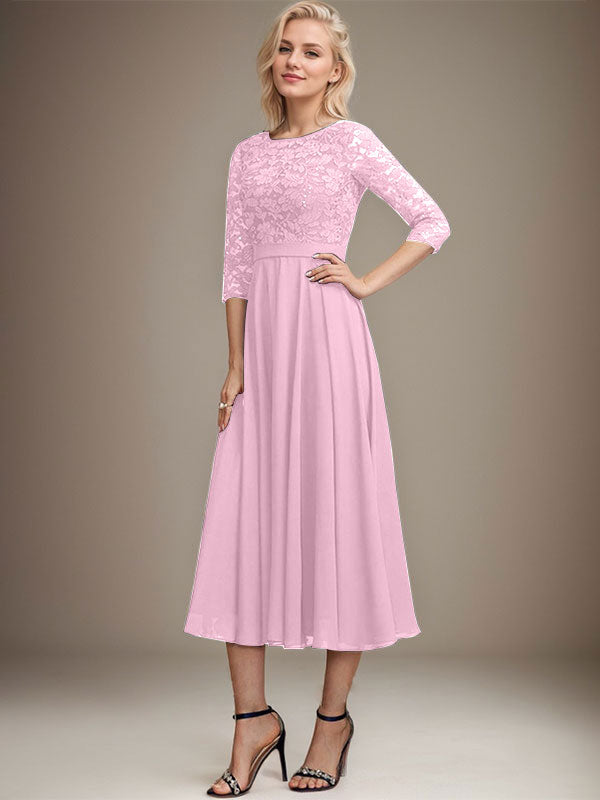 Vestido de novia de corte línea A, escote redondo, largo hasta la rodilla, de encaje y gasa con lentejuelas.