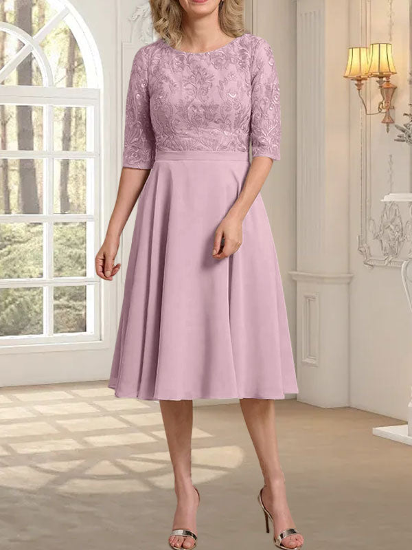 Vestido de novia de gasa de encaje, corte en A, escote redondo y largo hasta la rodilla.