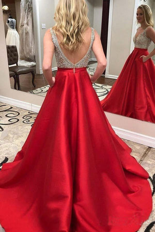 Robe de bal rouge en satin, ornée de perles et à décolleté en V profond, avec poche.