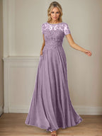 Robe en mousseline de soie bleu marine foncé, coupe trapèze, col bateau et sequins 