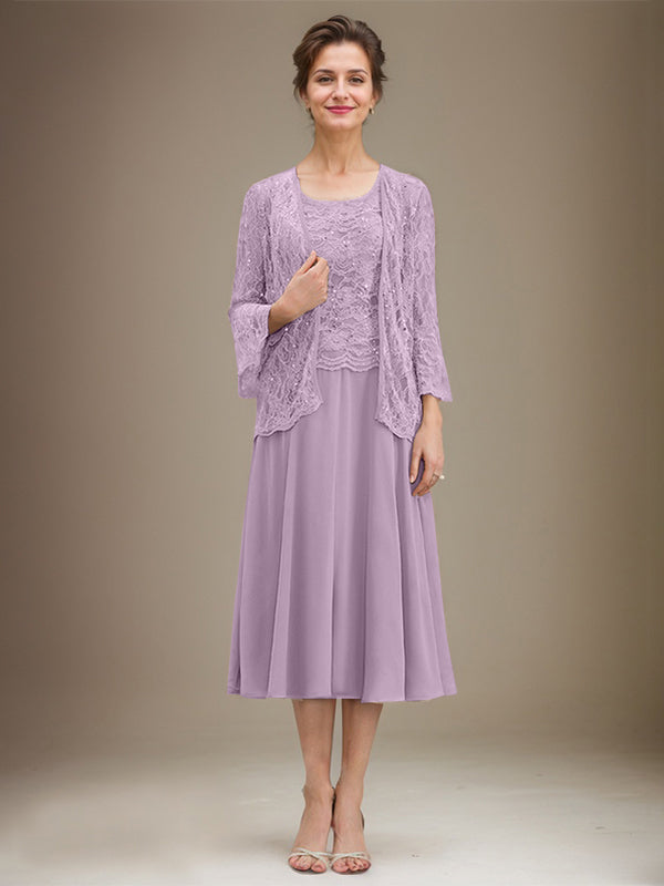 Vestido de novia de corte línea A, escote redondo, largo hasta la rodilla, de encaje y gasa con lentejuelas. 