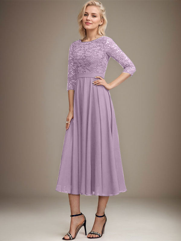 Vestido de novia de corte línea A, escote redondo, largo hasta la rodilla, de encaje y gasa con lentejuelas.