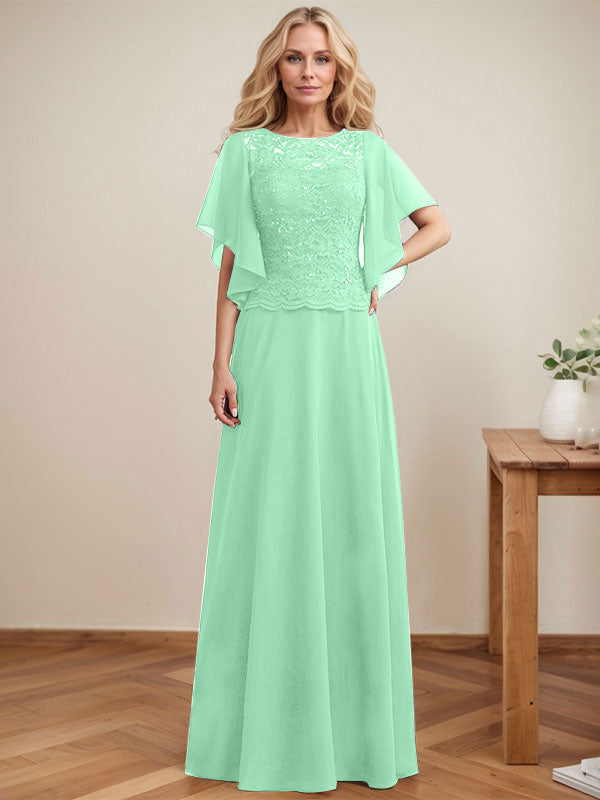 Vestido de novia de corte A, escote redondo, ilusión, largo hasta el suelo, de encaje y gasa con lentejuelas. 