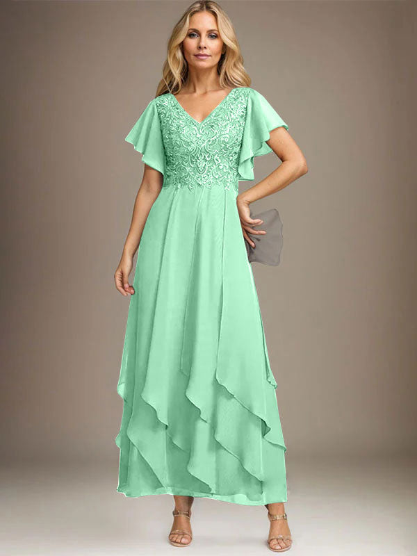Vestido de novia de corte línea A, escote en V, largo hasta el tobillo, de gasa de encaje con volantes en cascada. 
