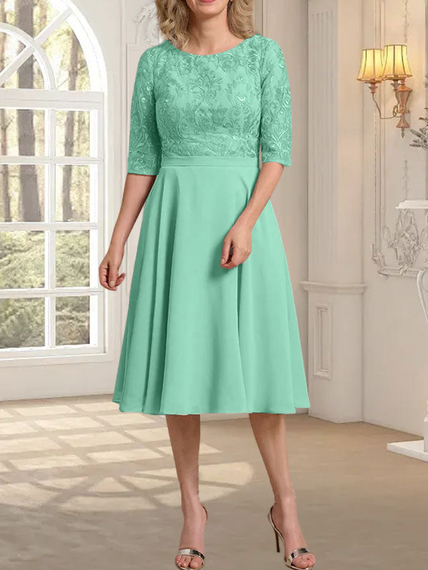 Vestido de novia de gasa de encaje, corte en A, escote redondo y largo hasta la rodilla.