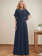 Vestido de novia de corte A, escote redondo, ilusión, largo hasta el suelo, de encaje y gasa con lentejuelas. 