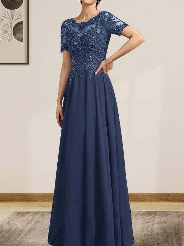 Vestido de corte A, escote ilusión, largo hasta el suelo, de gasa y encaje, con lentejuelas y pedrería, para la madre de la novia.