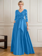 Vestido de novia de satén con encaje, corte en A, escote en V y largo hasta el suelo, con lazo de lentejuelas. 