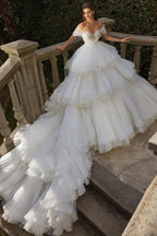 Robe de mariée luxueuse en tulle blanc à épaules dénudées et volants