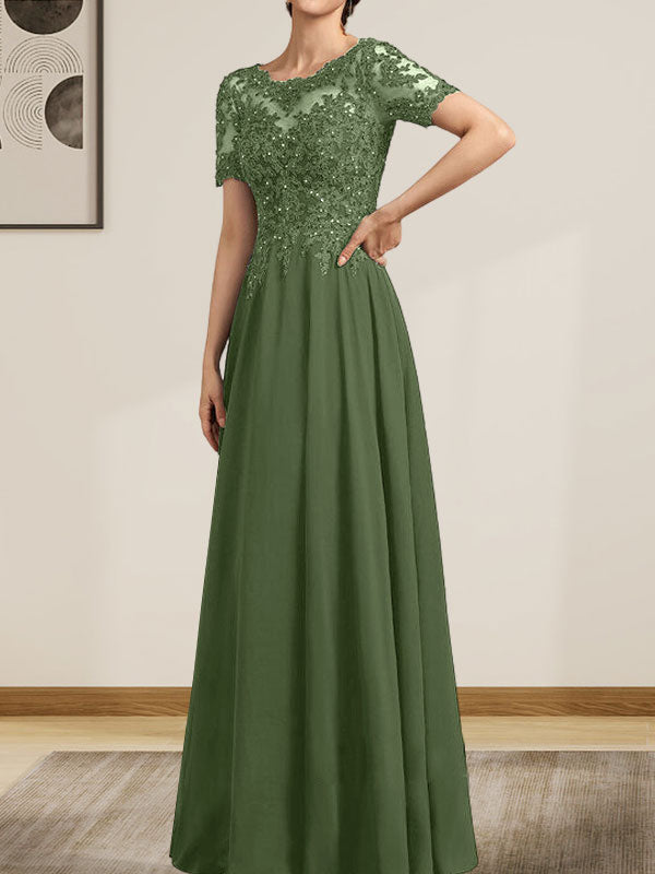 Vestido de corte A, escote ilusión, largo hasta el suelo, de gasa y encaje, con lentejuelas y pedrería, para la madre de la novia.