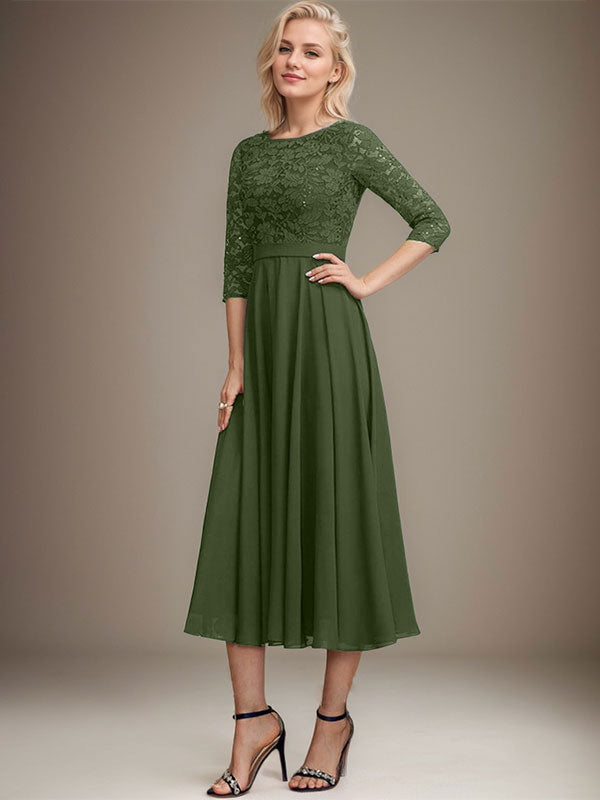 Vestido de novia de corte línea A, escote redondo, largo hasta la rodilla, de encaje y gasa con lentejuelas.