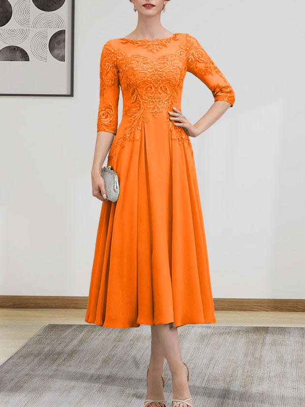 Vestido de novia de corte A, escote redondo ilusión, largo té, de gasa, encaje, con lentejuelas y pedrería.