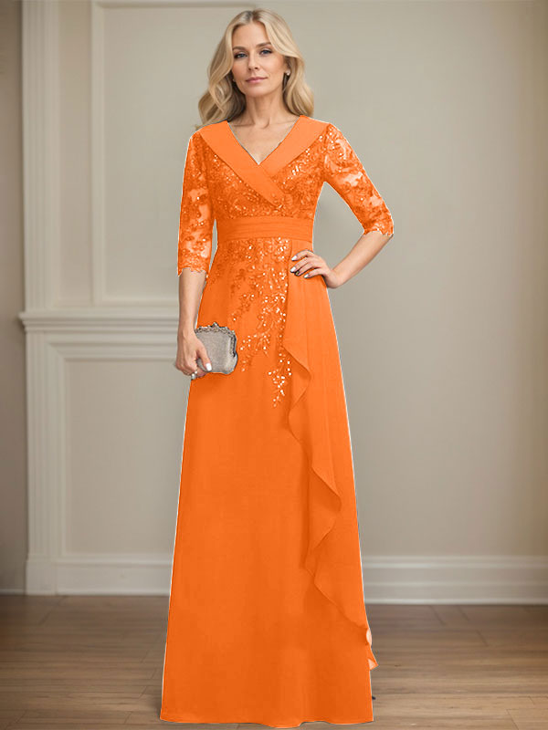 Vestido de novia de corte línea A, cuello en V, largo hasta el suelo, de encaje y gasa, con lentejuelas y volantes en cascada. 