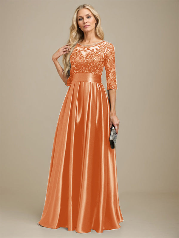 Robe de mariée longue en satin stretch dentelle et dentelle, coupe trapèze, décolleté illusion, ornée d'un nœud à sequins 