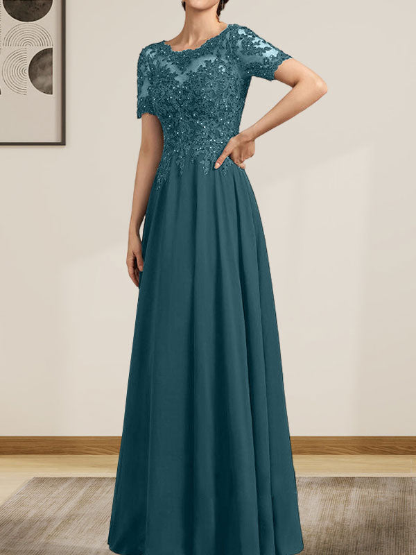 Vestido de corte A, escote ilusión, largo hasta el suelo, de gasa y encaje, con lentejuelas y pedrería, para la madre de la novia.