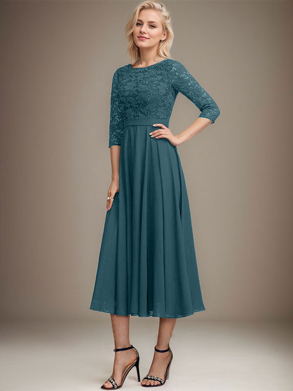 Vestido de novia de corte línea A, escote redondo, largo hasta la rodilla, de encaje y gasa con lentejuelas.