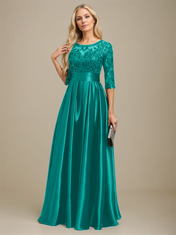 Robe de mariée longue en satin stretch dentelle et dentelle, coupe trapèze, décolleté illusion, ornée d'un nœud à sequins 