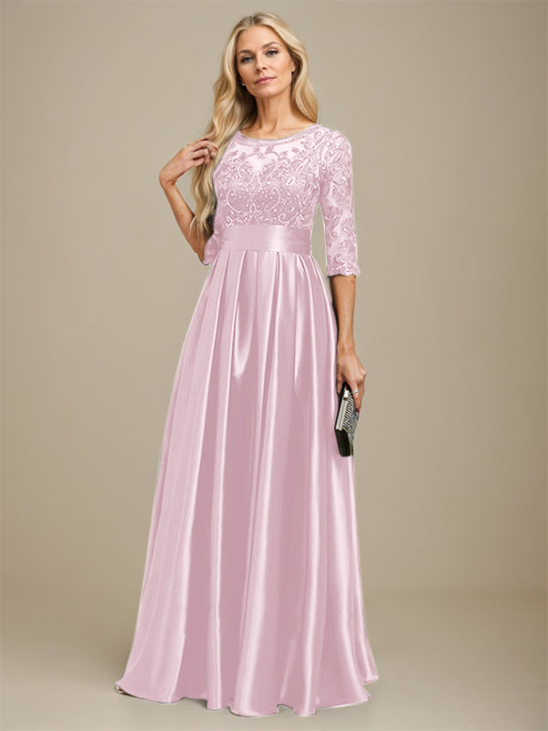 Robe de mariée longue en satin stretch dentelle et dentelle, coupe trapèze, décolleté illusion, ornée d'un nœud à sequins 