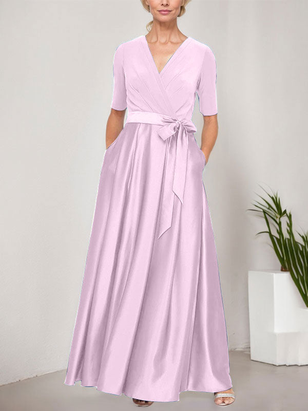 Vestido de baile con escote cruzado, falda amplia de satén y corpiño de jersey. 