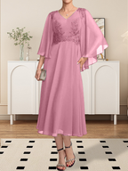 Vestido de corte A, escote en V, largo hasta la rodilla, de gasa, encaje, con lentejuelas y pedrería para la madre de la novia.