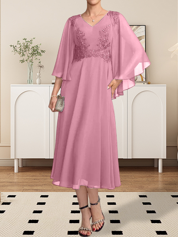 Vestido de corte A, escote en V, largo hasta la rodilla, de gasa, encaje, con lentejuelas y pedrería para la madre de la novia.