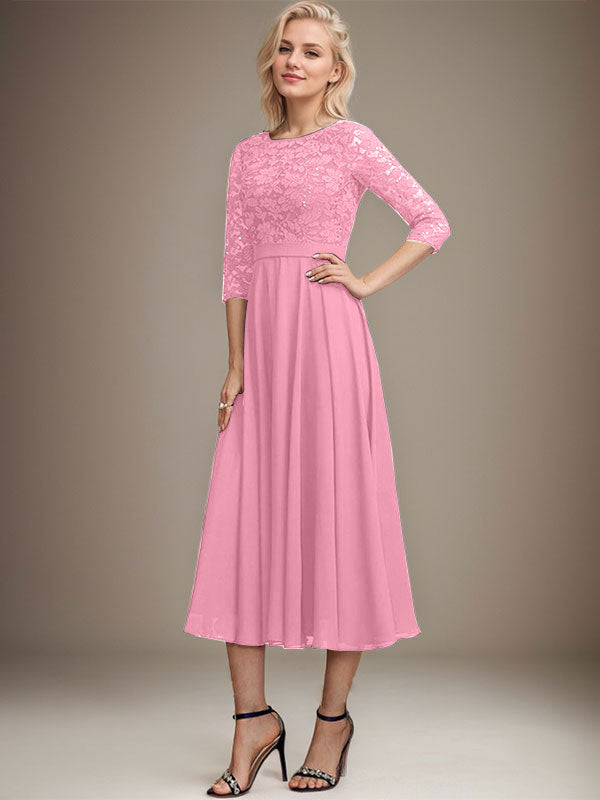 Vestido de novia de corte línea A, escote redondo, largo hasta la rodilla, de encaje y gasa con lentejuelas.