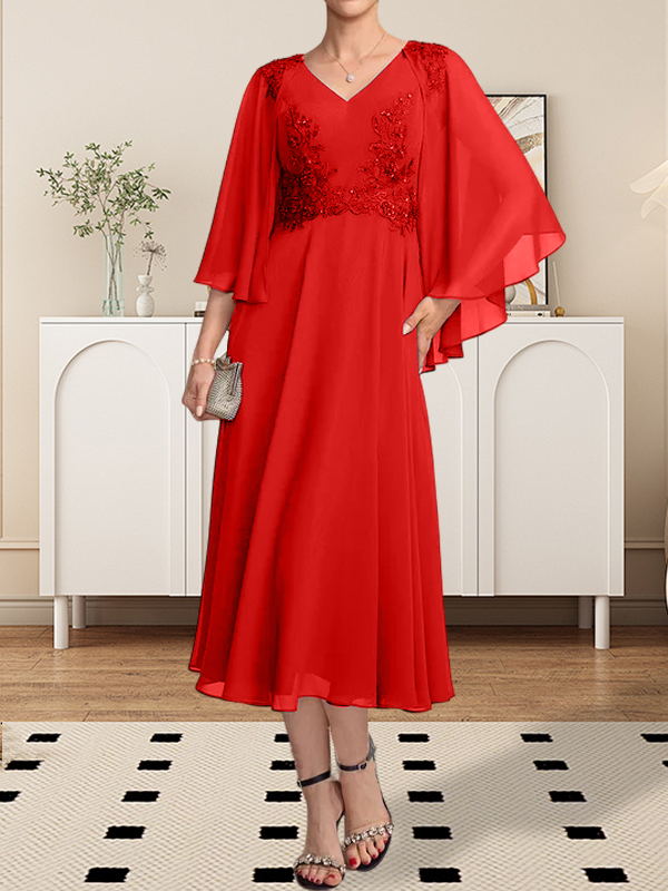 Vestido de corte A, escote en V, largo hasta la rodilla, de gasa, encaje, con lentejuelas y pedrería para la madre de la novia.