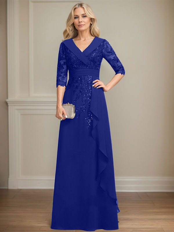 Vestido de novia de corte línea A, cuello en V, largo hasta el suelo, de encaje y gasa, con lentejuelas y volantes en cascada. 