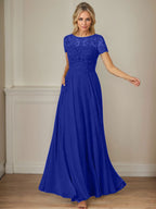Robe en mousseline de soie bleu marine foncé, coupe trapèze, col bateau et sequins 