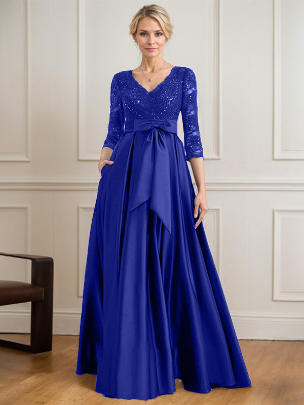 Vestido de novia de satén con encaje, corte en A, escote en V y largo hasta el suelo, con lazo de lentejuelas. 