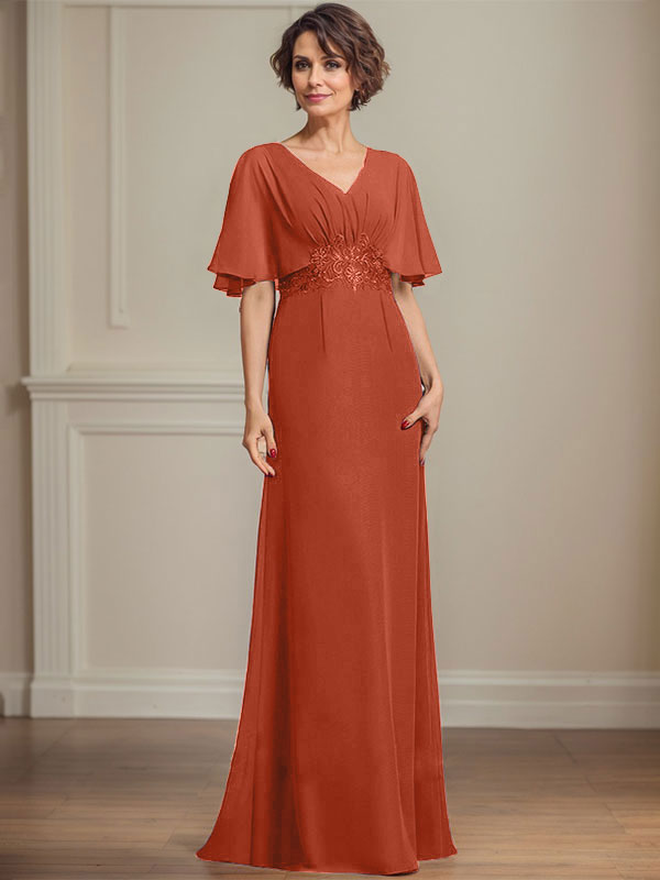 Robe de mariée longue en mousseline de soie, coupe trapèze, col en V, ornée d'appliques de sequins plissés et de dentelle.