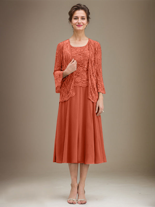 Vestido de novia de corte línea A, escote redondo, largo hasta la rodilla, de encaje y gasa con lentejuelas. 