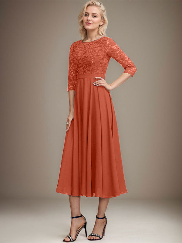 Vestido de novia de corte línea A, escote redondo, largo hasta la rodilla, de encaje y gasa con lentejuelas.