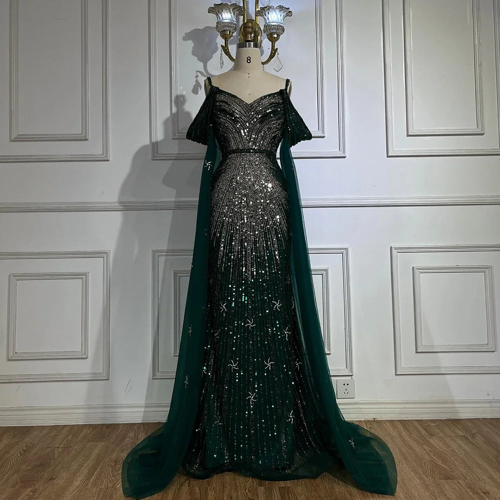Vestido de noche de lujo estilo sirena azul con tirantes finos y mangas tipo capa, ideal para ocasiones formales (modelo 2025). Fabricado en Arabia Saudita (LA72707). 