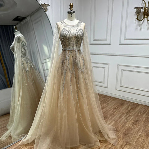 Robe de soirée longue arabe élégante bleu nude, coupe trapèze, perlée, avec manches cape, pour une occasion formelle, LA72785, 2025 