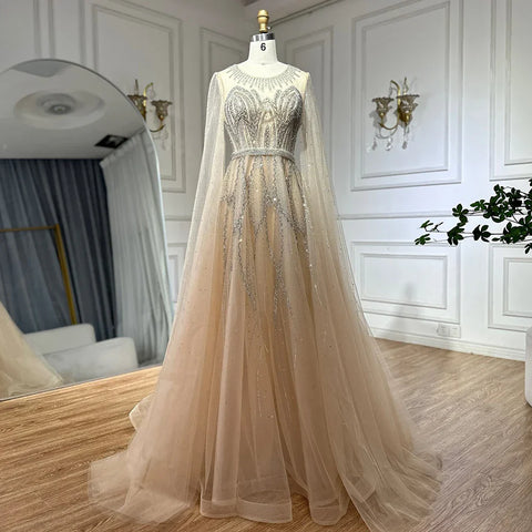 Robe de soirée longue arabe élégante bleu nude, coupe trapèze, perlée, avec manches cape, pour une occasion formelle, LA72785, 2025 