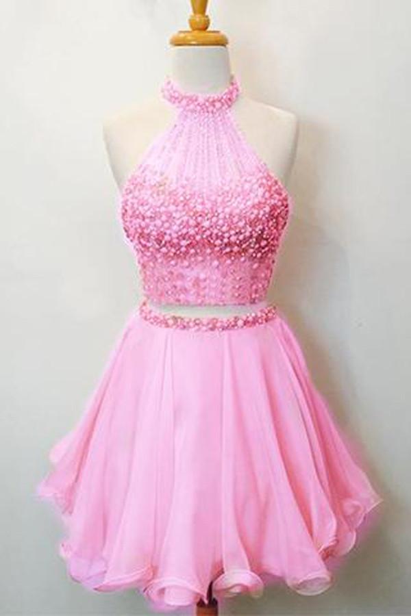 Robe de bal deux pièces rose fuchsia à col halter orné de perles et dos nu en forme de goutte