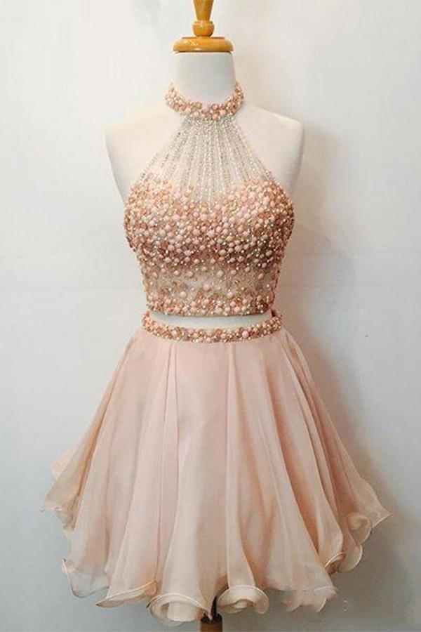 Robe de bal deux pièces rose fuchsia à col halter orné de perles et dos nu en forme de goutte