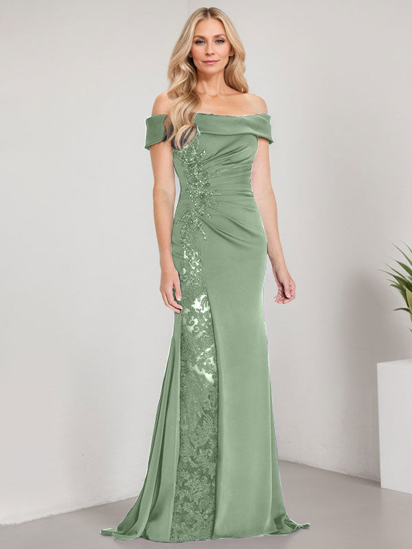 Vestido de corte sirena para la madre de la novia, largo hasta el suelo, con hombros descubiertos, apliques y pedrería, con abertura alta. 